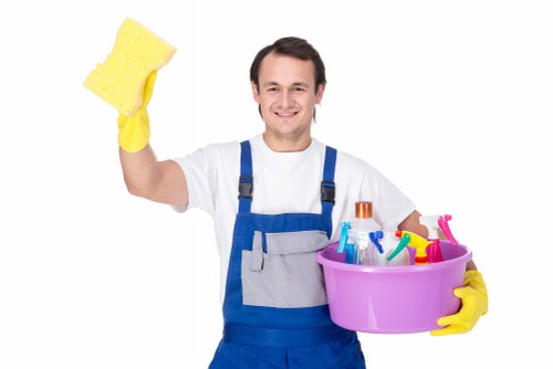 Staff member assessing a cleaning concern with documents